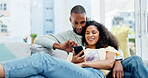 Happy couple, phone and relax on couch with laugh, bonding and funny meme on web at apartment. African people, partner and smile with mobile app, relationship and social media with video in house