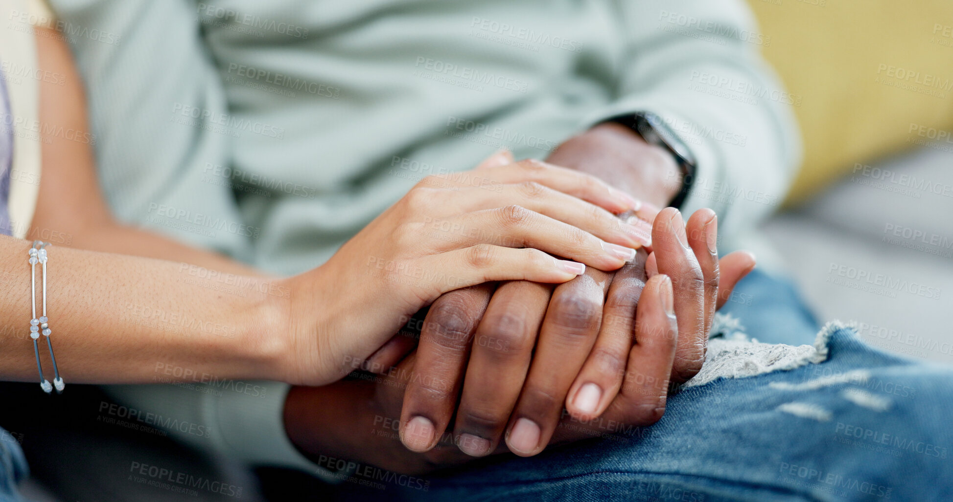 Buy stock photo Couple, holding hands and closeup on sofa with bonding, love and connection with care in living room. People, partnership and relationship with trust, loyalty and relax on couch in lounge at house