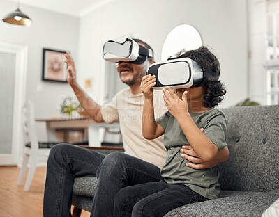 Buy stock photo Vr, gaming and father with son on sofa in family home for bonding, metaverse contest and esports. Augmented reality, virtual gamer and headset with man and child in living room of apartment for match