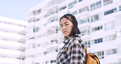 Buy stock photo City, portrait and asian woman on campus for education, travel and outdoor in urban town. Confident, serious and student or female person in backpack for university, college or academy with space