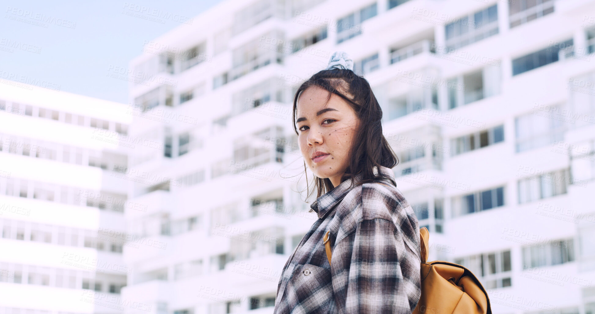 Buy stock photo City, portrait and asian woman on campus for education, travel and outdoor in urban town. Confident, serious and student or female person in backpack for university, college or academy with space