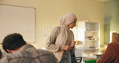 Buy stock photo Teacher, muslim woman and students in class for exam, test supervision and course evaluation. Teaching, progress and islamic educator at high school for learning guidance, assessment and monitor quiz