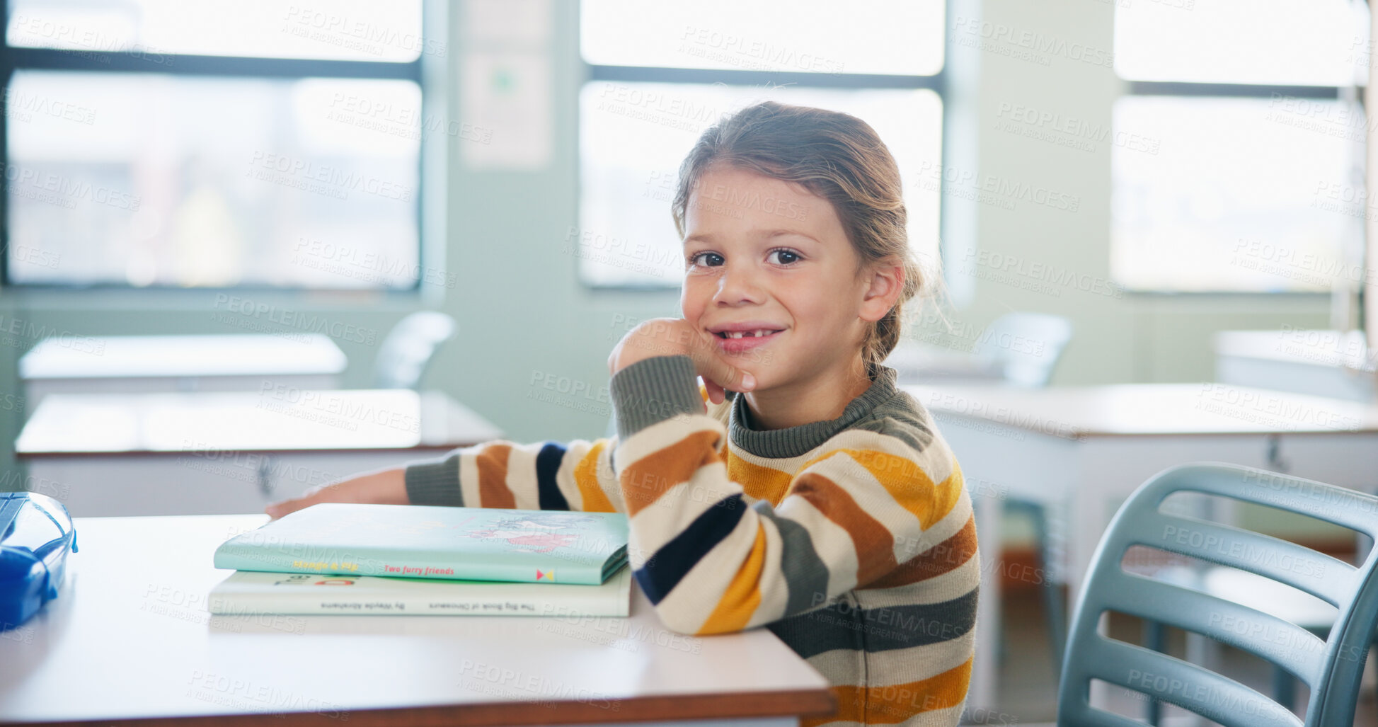 Buy stock photo Portrait, education and books with girl in classroom for test, child development and knowledge. Assessment, smile and lesson with student on school campus for learning, curriculum and study course