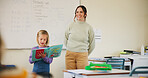 Kid, teacher and reading book in class for learning, teaching and language development at school. Storytelling, speaking and girl student with woman for support, presentation and education with words