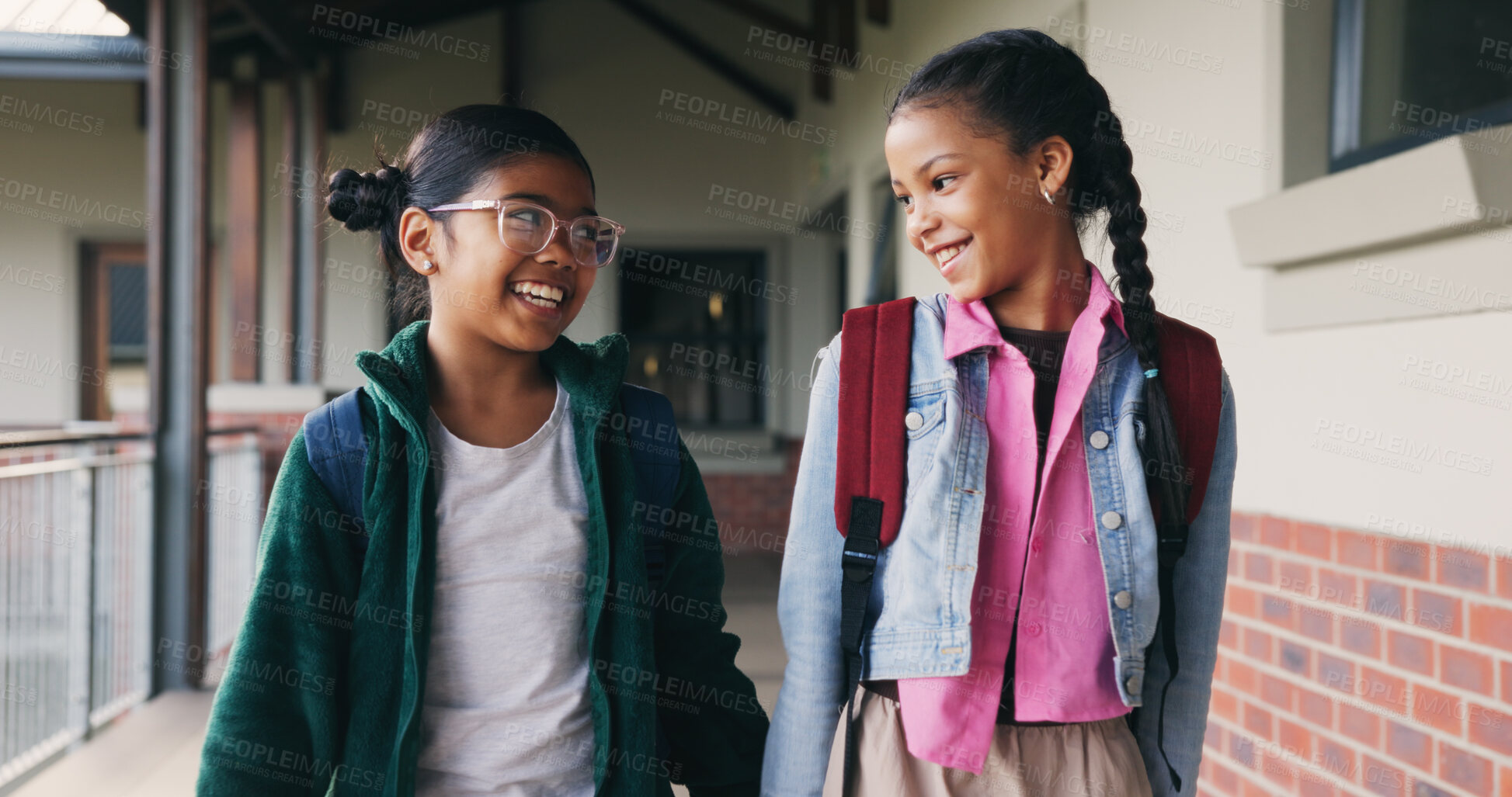 Buy stock photo Outdoor, friends and children with backpack at school, learning and happy with academic development. Students, talking and kids with smile for cognitive growth, education and walk to class in morning