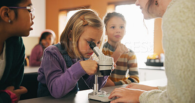 Buy stock photo Teacher, students and kids with microscope for learning, stem education and science lesson. Teaching, girl and children in classroom for biology project, analysis and test experiment in school