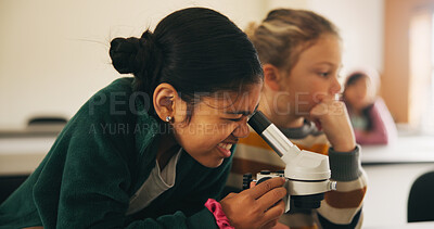 Buy stock photo Classroom, students and girl with microscope for learning, stem education and science lesson. Knowledge, smart and kid with tech equipment for biology project, analysis and test experiment in school