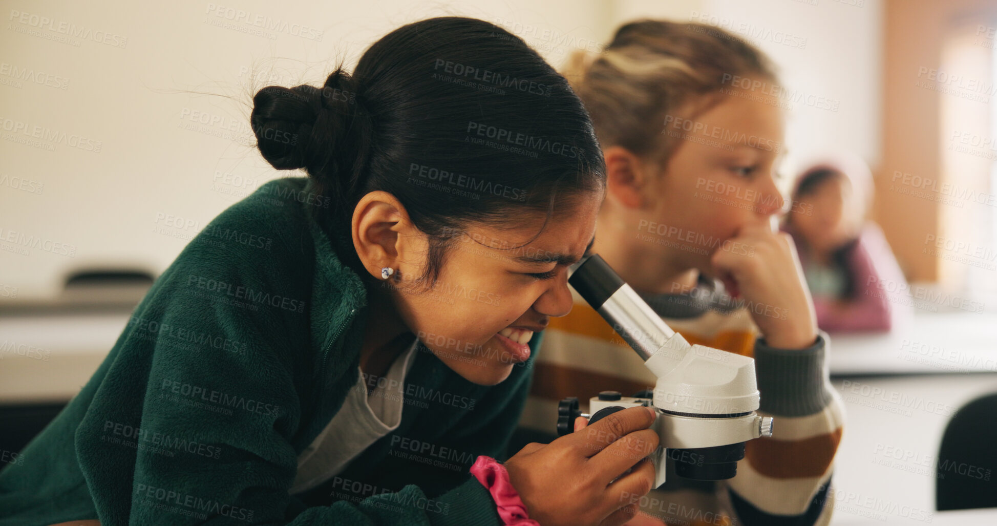 Buy stock photo Classroom, students and girl with microscope for learning, stem education and science lesson. Knowledge, smart and kid with tech equipment for biology project, analysis and test experiment in school