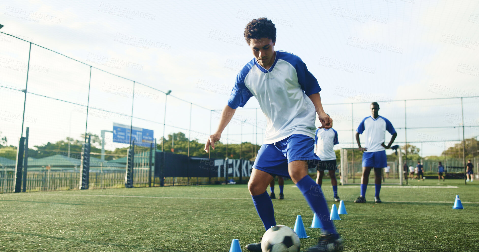 Buy stock photo Pitch, soccer and man with cone for training, game practice and running drills for sports. Football player, person and equipment on field for agile exercise, fitness challenge and ball control
