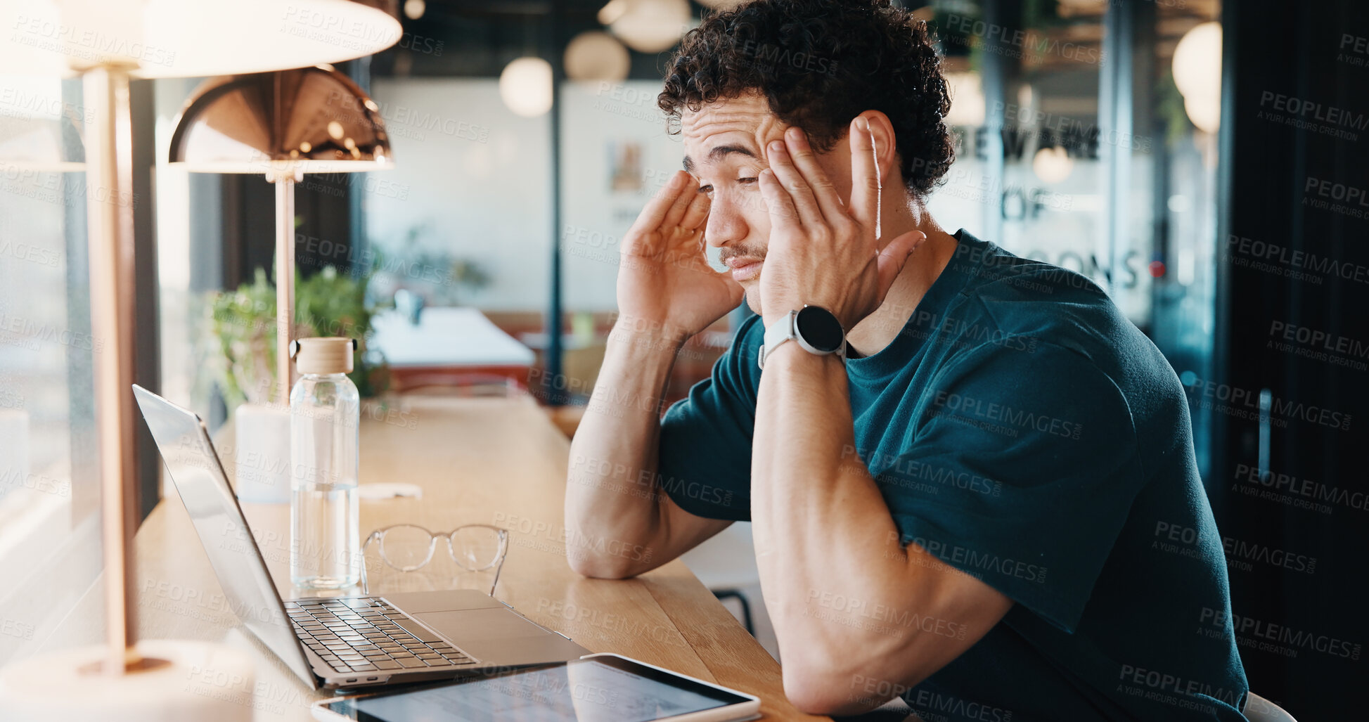 Buy stock photo Remote work, headache and man in cafe with laptop, burnout and tension with discomfort. Frustrated, freelancer and person in coffee shop with technology, brain fog and migraine with dizziness.