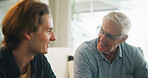 Love, home and elderly father with man for conversation, connection and bonding together on weekend. Senior dad, son or talking on sofa with parent for advice, smile and support in living room