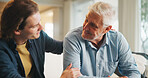 Support, home and senior father with man for conversation, connection and bonding together on weekend. Elderly dad, son or talking on sofa with parent for trust, smile and comfort in living room