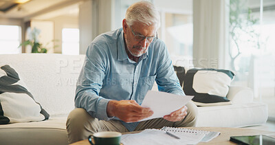 Buy stock photo Reading, documents and senior man on sofa with planning for insurance, retirement or assets in home. Policy, pension letter and person with paperwork for financial investment, savings or mortgage