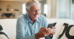 Smile, phone and elderly man on sofa with media, retirement wellness and new memory aid app. Senior person, mobile and happy in home for innovative software, connectivity and relax with networking