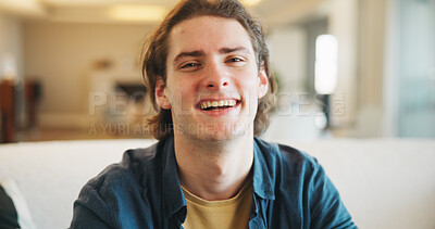 Buy stock photo Laughing, portrait and man on break in lounge, positive attitude or comfortable with smile on couch. Happy person, home and relax with pride on peaceful weekend, stress relief and chilling on sofa