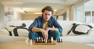 Buy stock photo Man, chess and game on sofa with strategy, solution or problem solving in contest in living room. Male person, boardgame and idea with competition for thinking, knowledge or challenge in home