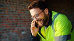 Architect, phone call and happy man with smile at construction site, safety and updates for contact. Civil engineer, laugh and person with mobile for discussion, quality assurance and architecture