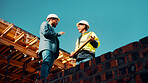 Talk, architect or manager with blueprint for construction design, building update or teamwork. Low angle, men or project foreman with floor plan on roof for progress, quality control or architecture