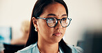 Glasses, reading and businesswoman in office with research for finance report with budget planning. Serious, thinking and Asian female financial manager with email for feedback on investment proposal