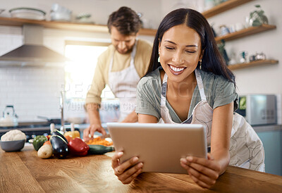 Buy stock photo Tablet, cooking or woman in kitchen, online recipe or nutrition blog to research ingredients. Smile, tech and person at home to meal prep, reading food guide or vegan diet for health with couple