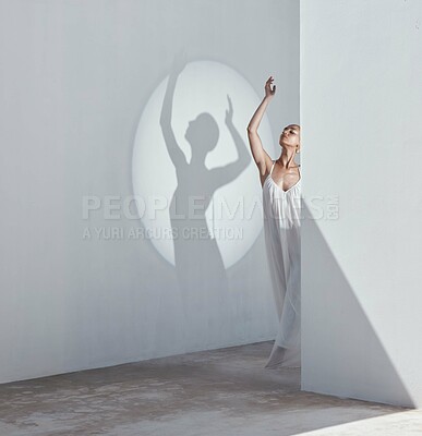 Buy stock photo Woman, fashion and dancer on wall with shadow, creative makeup or white dress for contemporary style. Space, artistic person and spotlight with beauty cosmetics, stylish clothes or dance performance.