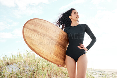 Buy stock photo Woman, surfboard and view at beach for exercise hobby, water sport and outdoor on holiday. Girl, surfer and travel with equipment for training, fitness and ready for waves by ocean in Colombia