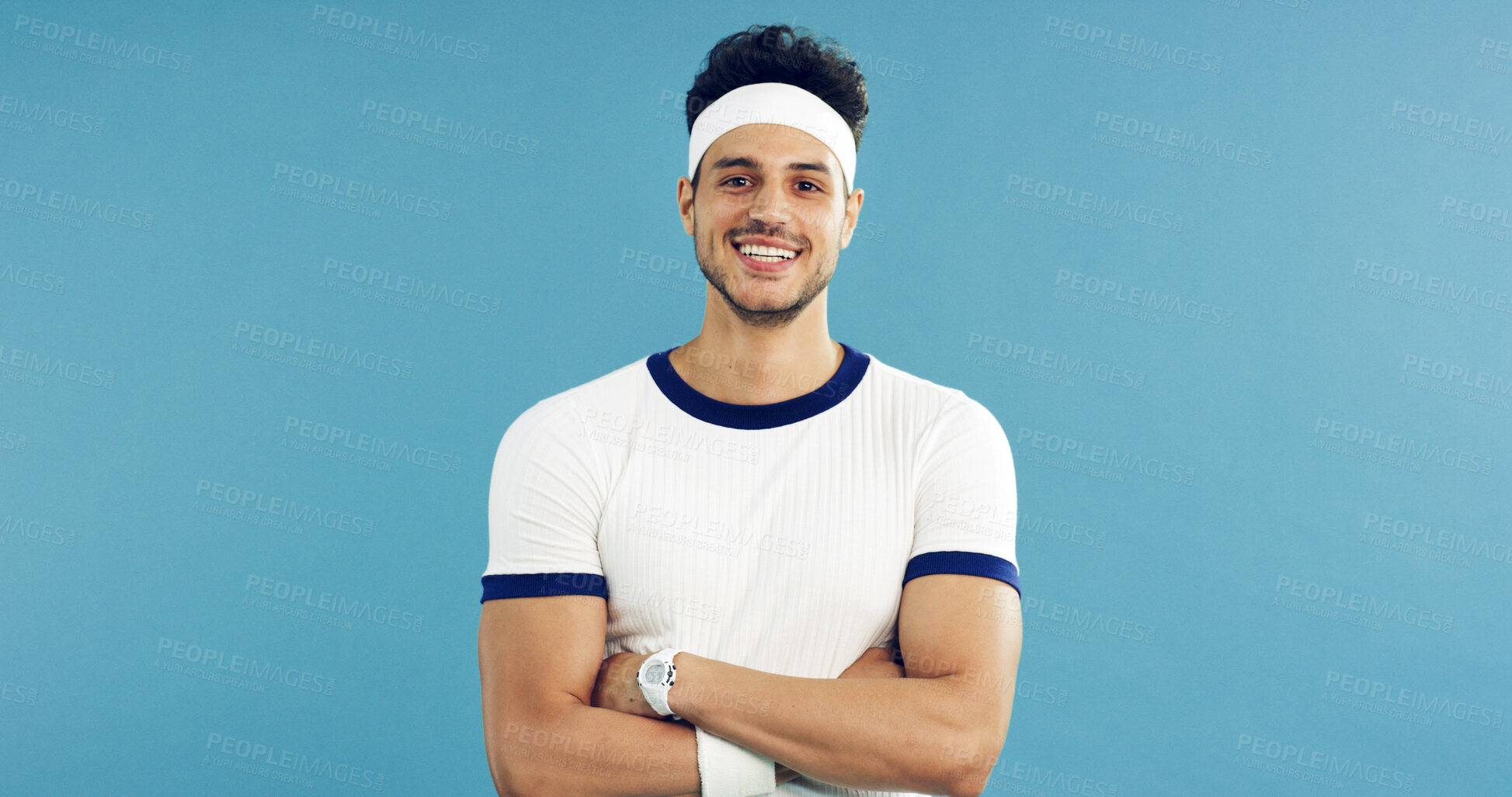 Buy stock photo Arms crossed, portrait and tennis with man on studio space for health, retro sports or wellness. Confidence, fitness and smile with person on blue background for competition, game or hobby as player