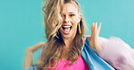 Portrait, celebrate and woman in studio for fashion sale, makeup or retro glamour on blue background. Excited person, style and winner with trendy discount, vintage deal and dance with good news