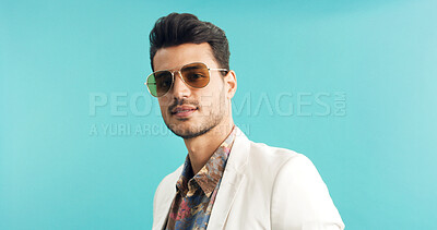 Buy stock photo Man, portrait or retro fashion with sunglasses in studio for old style or trend on a blue background. Male person, vintage or stylish outfit with shades for swag, nostalgic look or throwback on space