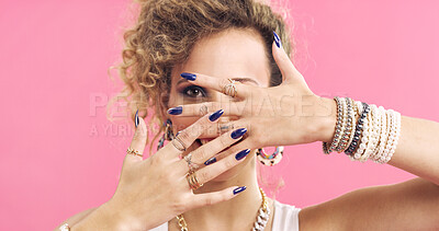 Buy stock photo Cover, face and woman in studio with accessories, retro and 80s style for fashion on pink background. Portrait, nails and cool person with hands for jewelry, bangles and rings for funky aesthetic