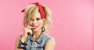 Buy stock photo Portrait, retro and woman in studio with accessories, 80s and fashion style on pink background. Bite, nail and edgy person with confident, punk and flirty expression for funky jewelry with space