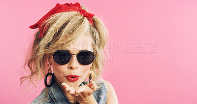 Buy stock photo Fashion, retro and woman with blowing kiss, pop clothing or classic outfit in 80s aesthetic. Playful, mockup space and person with sunglasses, vintage apparel or rock style on studio background.