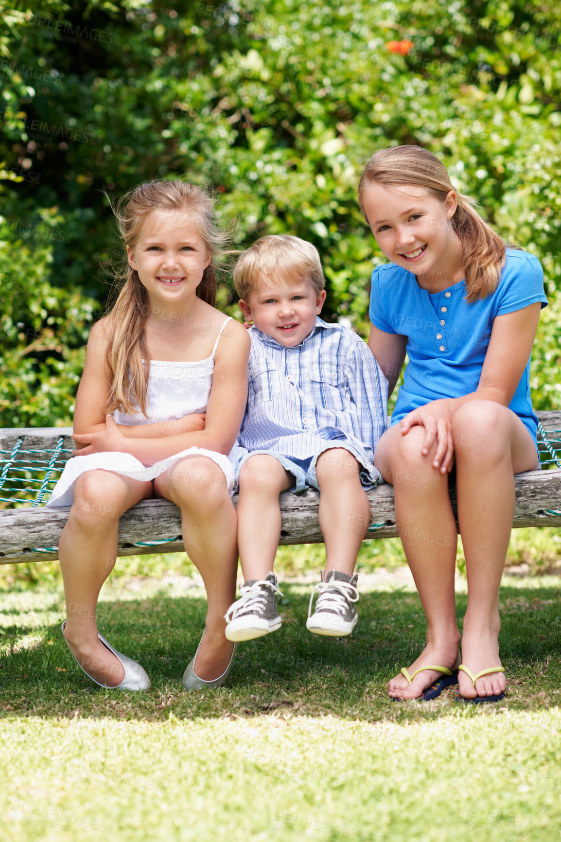 Buy stock photo Family, children and portrait in park with care, sibling love or relationship development with smile. Boy, big sisters responsibility and outdoor with happiness for support, bonding or summer holiday