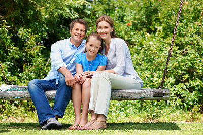 Buy stock photo Break, portrait and summer with family on swing in backyard together for bonding or conversation. Daughter, parents and smile in garden of home with happy people outdoor for relationship security