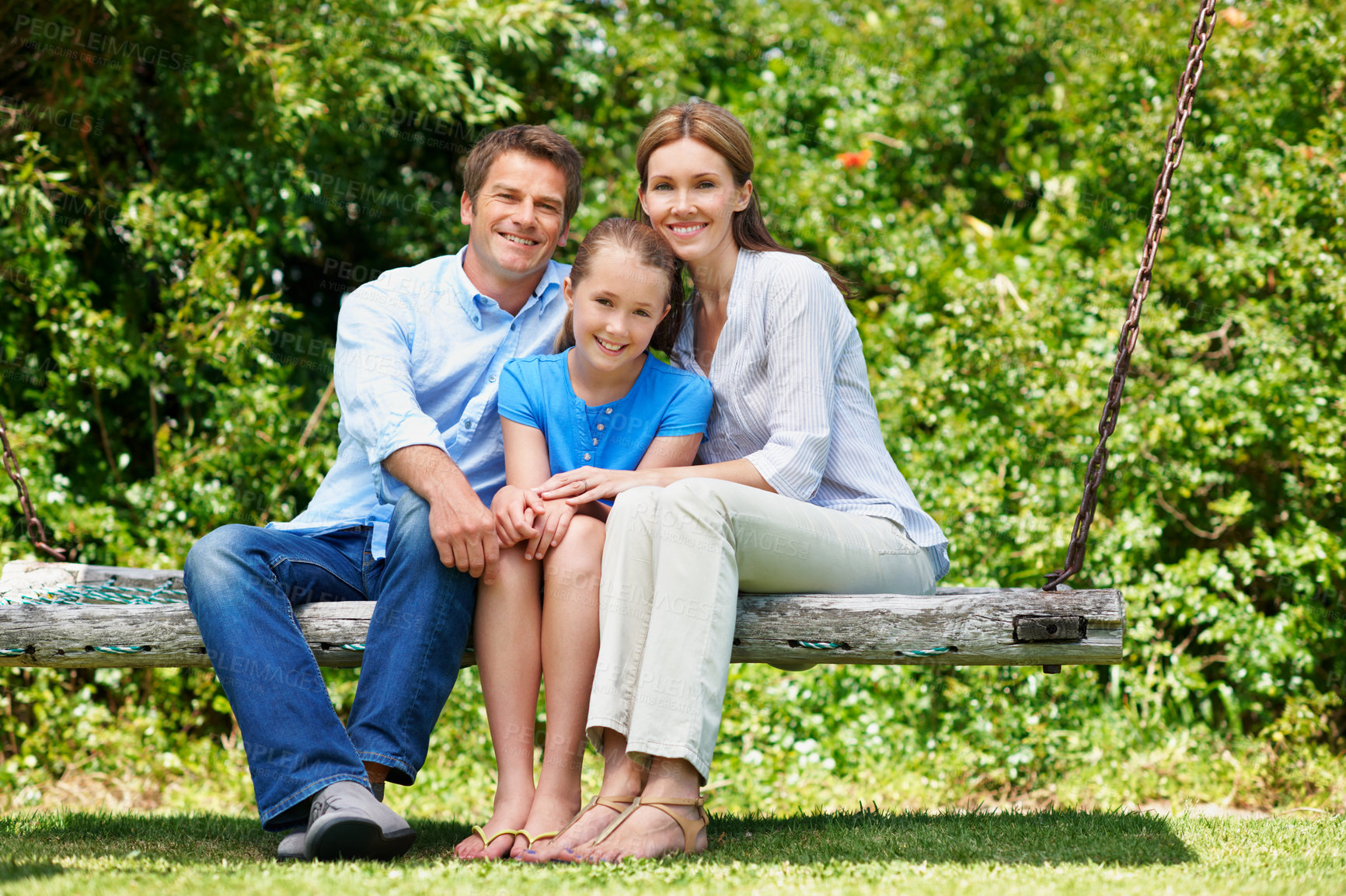 Buy stock photo Break, portrait and summer with family on swing in backyard together for bonding or conversation. Daughter, parents and smile in garden of home with happy people outdoor for relationship security