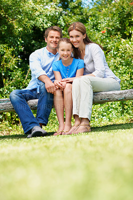 Buy stock photo Happy, parents and relax with child at park for love, affection and bonding together on holiday. Portrait, people and daughter for compassion, family connection and vacation getaway in countryside