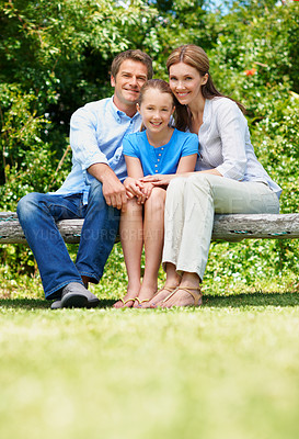 Buy stock photo Portrait, parents and relax with child on bench for love, affection and bonding together on holiday. Smile, people and daughter with wellness, family connection and vacation getaway in countryside