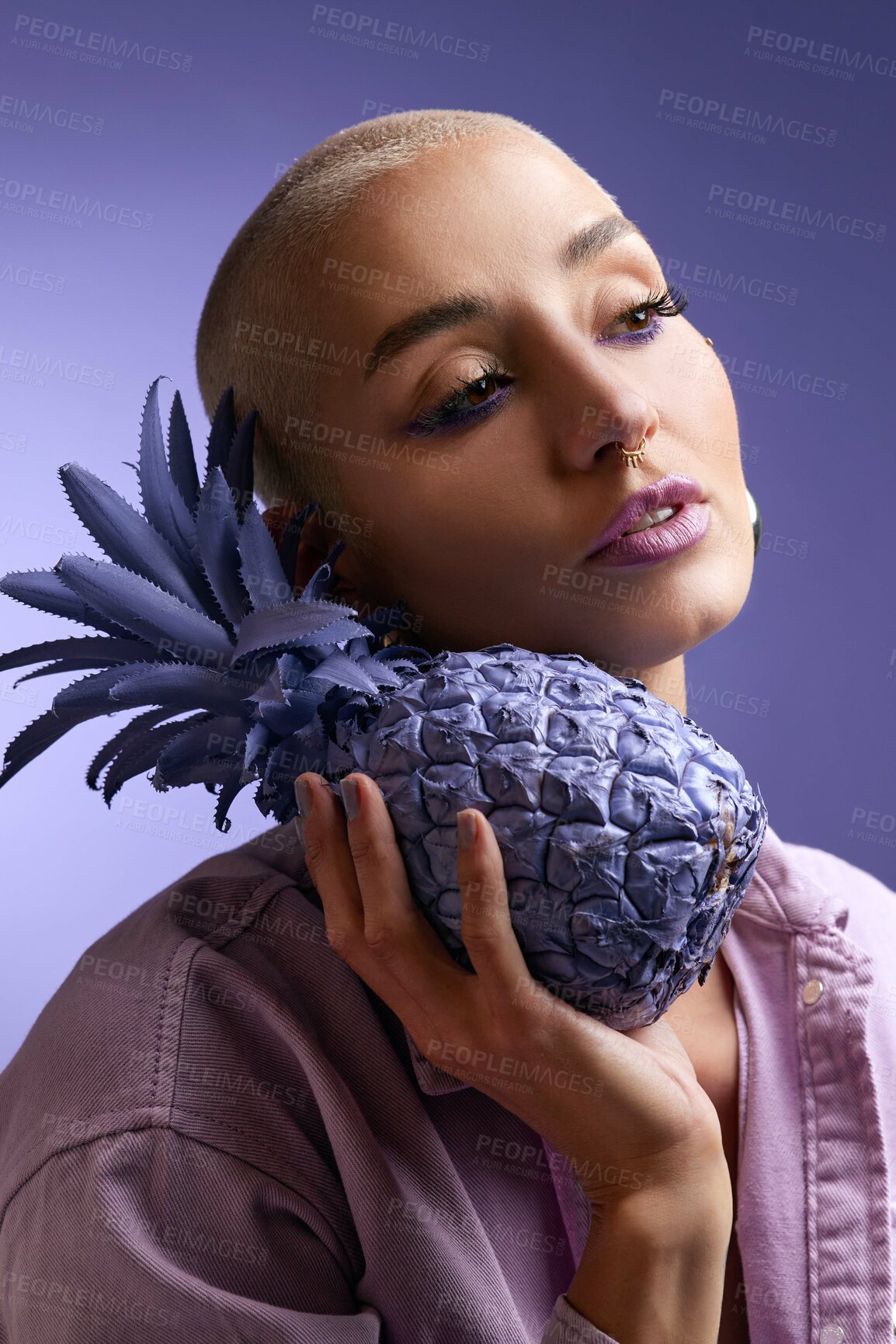 Buy stock photo Thinking, makeup or woman with pineapple in studio, creative aesthetic or artistic style for beauty. Vision, organic fruit or person with bold cosmetics for individuality, trendy or purple background
