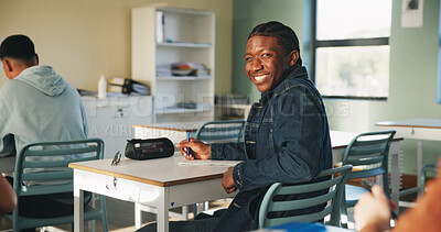 Buy stock photo College, man and happy in class portrait for academic test, learning assessment and study pride. Student, confident person and exam paper at academy for course assignment, knowledge and development