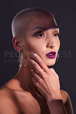 Buy stock photo Makeup, creative and woman in studio with glow for beauty or colorful cosmetics on dark background. Skincare, thinking and person with bold lipstick, aesthetic and edgy style for unique and artistic