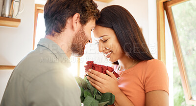 Buy stock photo Smile, couple and love with flowers in home for care, partner appreciation and anniversary gift. Happy, people and roses with affection for loyalty, gratitude and romantic present on special occasion