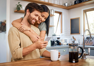 Buy stock photo Couple, love and phone in kitchen with coffee, date reservation and anniversary reminder in calendar. Happy woman, man and mobile in home for social media memory, browsing app and hug with drink