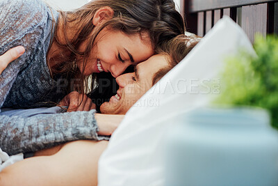 Buy stock photo Love, relax and smile with couple in bed together for anniversary, holiday or honeymoon. Affection, moment and romance with happy people in bedroom of hotel for break, hospitality or vacation