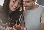 Beautiful man woman couple using smart phone technology to connect to social media