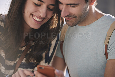 Buy stock photo Couple, online and happy people with phone on holiday, bonding and check message on social media. Man, reading and woman with mobile on vacation, travel and chat together for communication outdoor