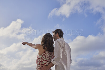 Buy stock photo Couple, back and sky with travel, sightseeing and hug with pointing for view on summer vacation. People, partner and embrace with space, tourism and connection with memory, love or bonding on holiday