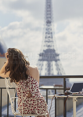 Buy stock photo Back, Eiffel Tower and woman on balcony of hotel for accommodation, sightseeing or travel. Holiday, vacation and view with photographer or tourist on veranda with camera and laptop for hospitality