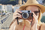 Woman travel in beautiful Italy taking photos vintage camera summer vacation exploring to discover coastal Amalfi