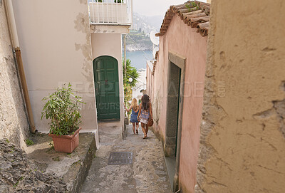 Buy stock photo Holiday, travel and walking with friends in old city together for adventure, journey or sightseeing. Back, building and tourism with women outdoor in historic town to discover or explore culture
