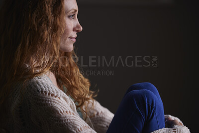 Buy stock photo Relax, space and thinking with woman in home for contemplation, reflection or vision. Break, future and happy with thoughtful person on dark background for daydreaming, inspiration or memories